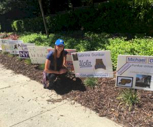 (Pictured - scholarship winner Sabrina Dunbar. Neighbors posted signs congratulating this year’s graduates)