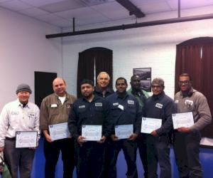 Pictured from L-R: Chris Cheah, Brian Clarke, Wilver Villagran, Dan Fittro, Raymundo Perez, Bobby Alford, Miguel Torres and Lawrence Wilder