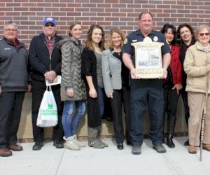 Clow Valve donates historical brass sign holders