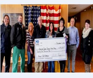 Presenting the check from left to right: Ryan Grassley, David Cook, Karen Tuckett, Joe Carter, Angie Reece, Barbara Bassett (American Cancer Society), David Hiestand, and Cidne Christensen (American Cancer Society) Davy Crockett is not pictured, but he d